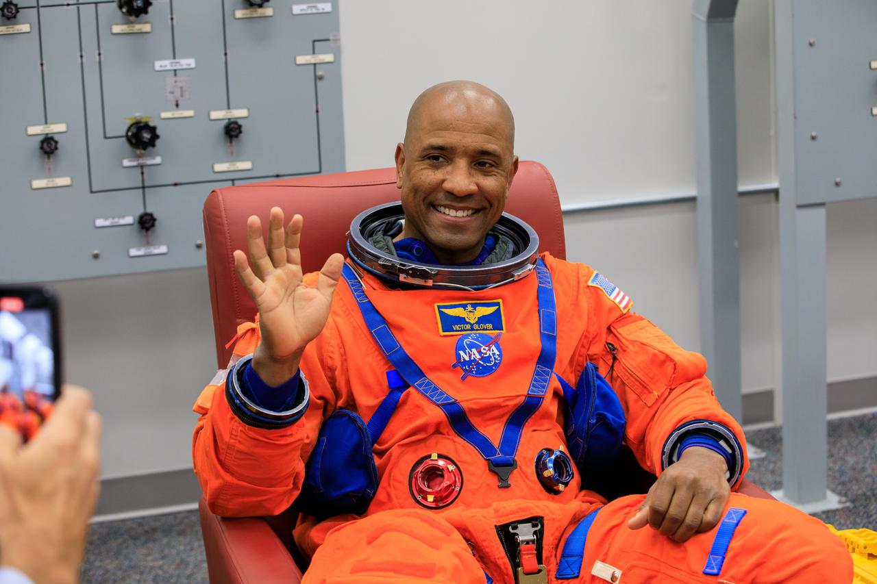 Inside the Astronaut Crew Quarters at the Neil Armstrong Operations and Checkout Building at NASA’s Kennedy Space Center in Florida, Artemis II crew member NASA astronaut Victor Glover is shown wearing a test version of the Orion crew survival system spacesuits the crew will wear on launch day as part of an integrated ground systems test on Wednesday, Sept. 20.
