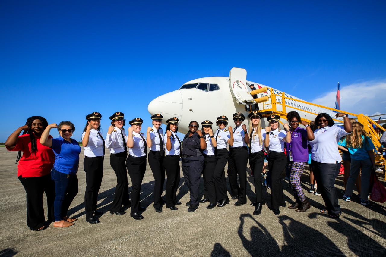 From left, NASA’s Kennedy Space Center senior managers Barbara L. Brown, director of Exploration Research and Technology Programs; Janet Sellars, director of Human Resources; Hortense Blackwell, director of Center Engagement and Business Integration Services; and Kimberlyn B. Carter, associate program manager for Exploration Ground Systems pose with members of the all-female crew for Delta Air Lines’ Women Inspiring Our Next Generation (WING) flight after the crew touched down at the Launch and Landing Facility at Kennedy on Friday, Sept. 22, 2023. The flight brought girls from Atlanta, Georgia, ranging in age from 12 to 18, to learn about the various careers available at the Florida spaceport. While at Kennedy, the group had the opportunity to view center facilities, hear from a panel of women with a combination of careers from Kennedy and Delta, and tour the visitor complex.