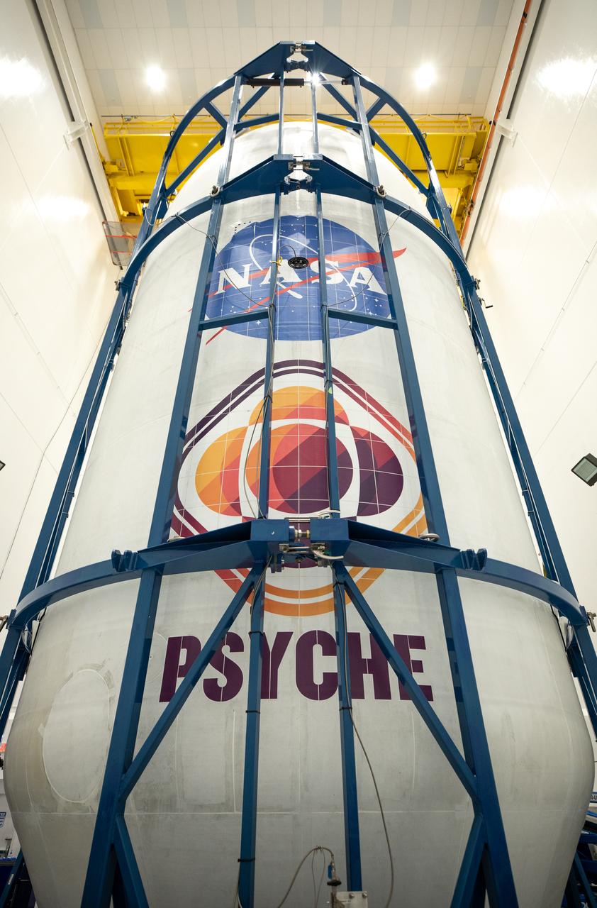 Technicians encapsulate NASA’s Psyche spacecraft in its payload fairings – the cone at the top of the rocket – at the Astrotech Space Operations facility in Titusville, Florida, on Tuesday, Oct. 3, 2023. Next, the spacecraft will move to SpaceX facilities at NASA’s Kennedy Space Center. Bound for a metal-rich asteroid of the same name, the Psyche mission is targeting Thursday, Oct. 12, to launch from Kennedy. Liftoff, atop a SpaceX Falcon Heavy rocket, is targeted for 10:16 a.m. EDT from Launch Complex 39A. 