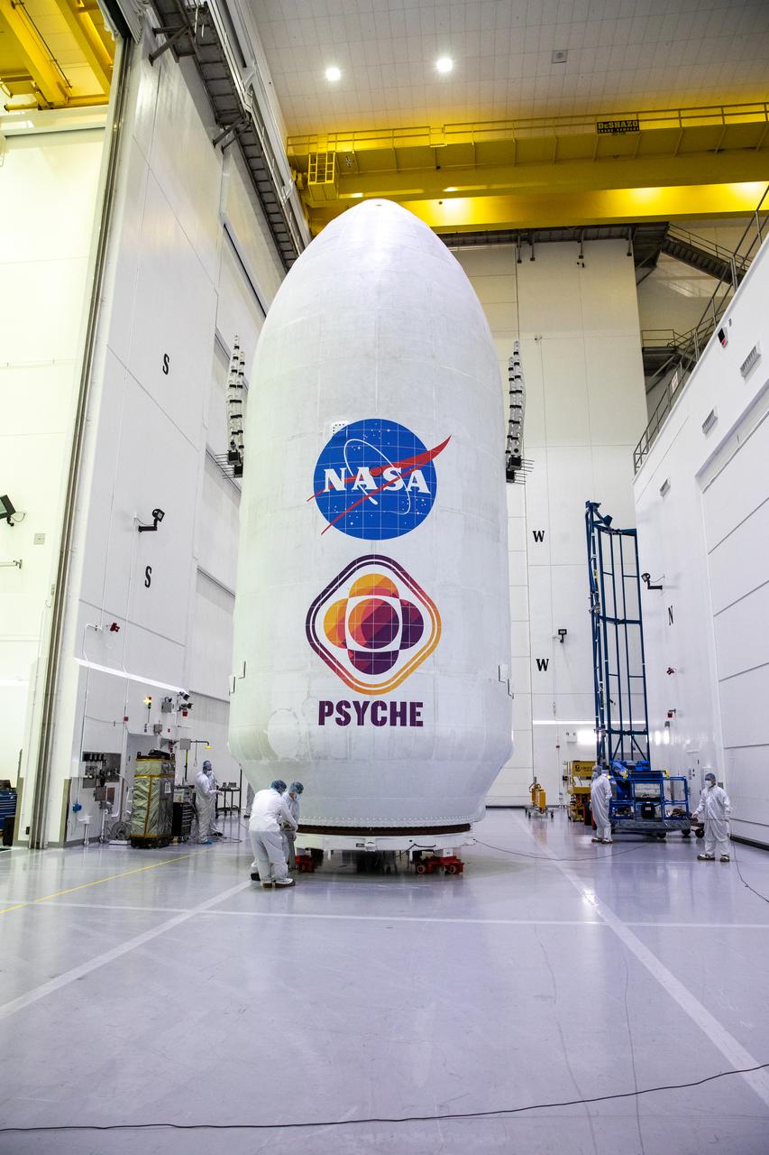 Teams transport NASA's encapsulated Psyche spacecraft from the Astrotech Space Operations Facility in Titusville to Launch Pad 39A at Kennedy Space Center in Florida on Friday, Oct. 6, 2023. Psyche will launch atop a SpaceX Falcon Heavy rocket. Liftoff is targeted for 10:16 a.m. EDT Thursday, Oct. 12. Riding with Psyche is a pioneering technology demonstration, NASA's Deep Space Optical Communications (DSOC) experiment.
