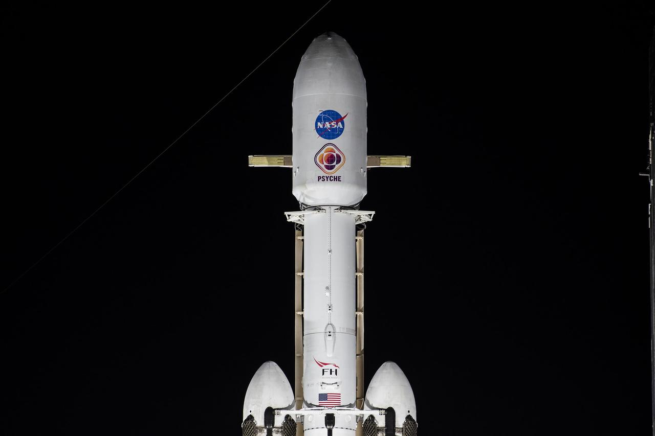 NASA’s Psyche spacecraft stands tall atop a SpaceX Falcon Heavy rocket at Kennedy Space Center’s historic Launch Complex 39A in Florida on Tuesday, Oct. 10, 2023. Liftoff of the mission to the asteroid Psyche is targeted for 10:16 a.m. EDT on Thursday, Oct. 12. The spacecraft also is hosting a technology demonstration, NASA’s Deep Space Optical Communications (DSOC), which will be the first test of laser communications beyond the Moon. NASA’s Launch Services Program, based at Kennedy, is responsible for the insight and approval of the launch vehicle and manages the launch service for the Psyche mission.