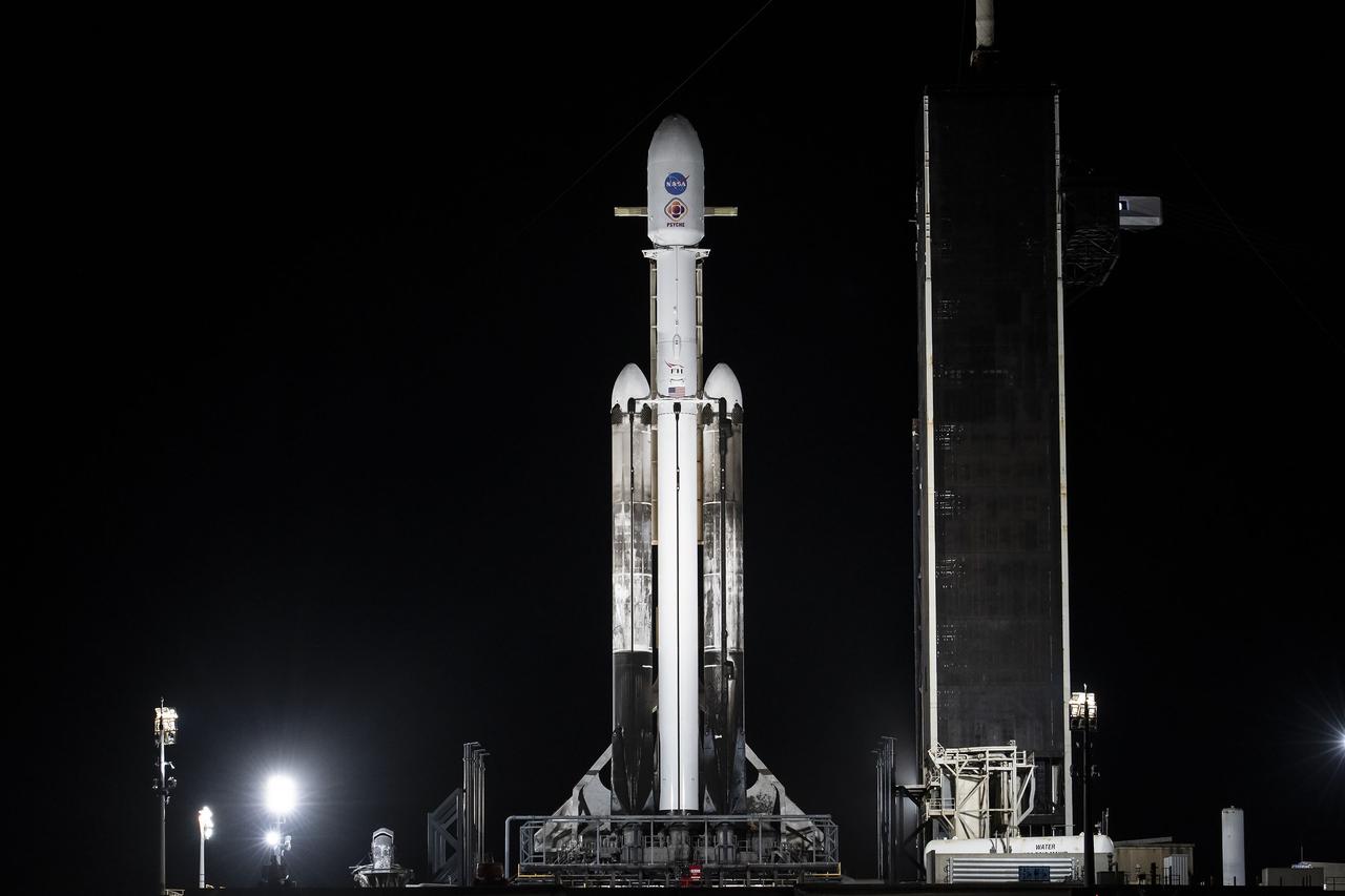 NASA’s Psyche spacecraft stands tall atop a SpaceX Falcon Heavy rocket at Kennedy Space Center’s historic Launch Complex 39A in Florida on Tuesday, Oct. 10, 2023. Liftoff of the mission to the asteroid Psyche is targeted for 10:16 a.m. EDT on Thursday, Oct. 12. The spacecraft also is hosting a technology demonstration, NASA’s Deep Space Optical Communications (DSOC), which will be the first test of laser communications beyond the Moon. NASA’s Launch Services Program, based at Kennedy, is responsible for the insight and approval of the launch vehicle and manages the launch service for the Psyche mission.