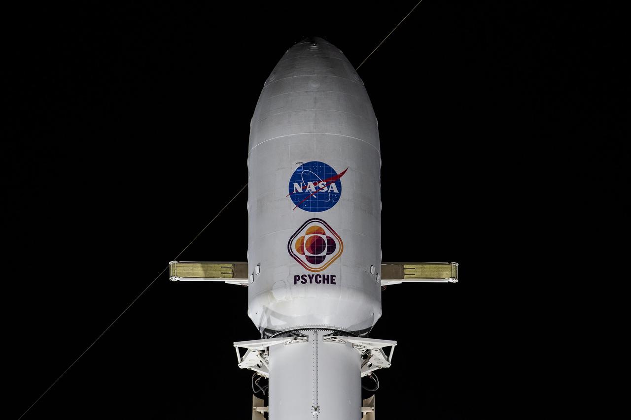 NASA’s Psyche spacecraft stands tall atop a SpaceX Falcon Heavy rocket at Kennedy Space Center’s historic Launch Complex 39A in Florida on Tuesday, Oct. 10, 2023. Liftoff of the mission to the asteroid Psyche is targeted for 10:16 a.m. EDT on Thursday, Oct. 12. The spacecraft also is hosting a technology demonstration, NASA’s Deep Space Optical Communications (DSOC), which will be the first test of laser communications beyond the Moon. NASA’s Launch Services Program, based at Kennedy, is responsible for the insight and approval of the launch vehicle and manages the launch service for the Psyche mission.