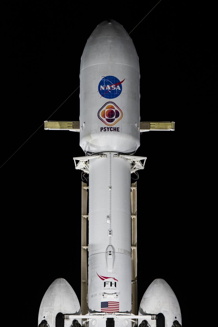 NASA’s Psyche spacecraft stands tall atop a SpaceX Falcon Heavy rocket at Kennedy Space Center’s historic Launch Complex 39A in Florida on Tuesday, Oct. 10, 2023. Liftoff of the mission to the asteroid Psyche is targeted for 10:16 a.m. EDT on Thursday, Oct. 12. The spacecraft also is hosting a technology demonstration, NASA’s Deep Space Optical Communications (DSOC), which will be the first test of laser communications beyond the Moon. NASA’s Launch Services Program, based at Kennedy, is responsible for the insight and approval of the launch vehicle and manages the launch service for the Psyche mission.