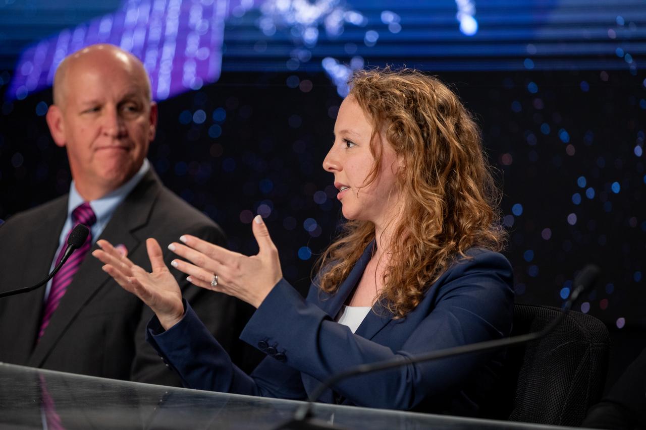 Julianna Scheiman, director, Civil Satellite Missions, SpaceX, addresses the media during a Psyche mission prelaunch news conference at NASA’s Kennedy Space Center in Florida on Wednesday, Oct. 11, 2023. To her left is Tim Dunn, senior launch director, NASA’s Launch Services Program. Psyche is the first mission to explore an asteroid with a surface that likely contains substantial amounts of metal rather than rock or ice. Liftoff of NASA’s Psyche spacecraft, atop a SpaceX Falcon Heavy rocket, is targeted for 10:16 a.m. EDT Thursday, Oct. 12, from Kennedy’s Launch Complex 39A.