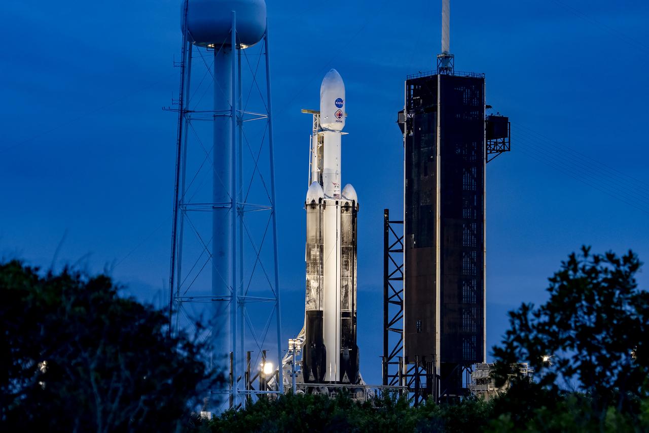 NASA’s Psyche spacecraft stands tall atop a SpaceX Falcon Heavy rocket at Kennedy Space Center’s historic Launch Complex 39A in Florida on Thursday, Oct. 12, 2023. Liftoff of Psyche is targeted for 10:19 a.m. EDT Friday, Oct. 13. The mission will explore an asteroid that scientists hope will help solve mysteries of our solar system for the benefit of humanity. This includes, for the first time, examining a world dominantly made not of rock or ice, but of metal, to answer fundamental questions about Earth’s own metal core and the formation of our solar system. Psyche also will carry a technology demonstration – NASA’s Deep Space Optical Communications (DSOC) experiment – that will test a next-generation way to communicate from space.