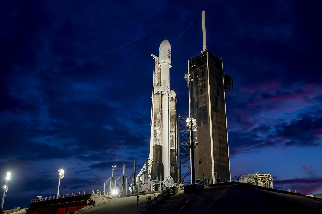 NASA’s Psyche spacecraft stands tall atop a SpaceX Falcon Heavy rocket at Kennedy Space Center’s historic Launch Complex 39A in Florida on Thursday, Oct. 12, 2023. Liftoff of Psyche is targeted for 10:19 a.m. EDT Friday, Oct. 13. The mission will explore an asteroid that scientists hope will help solve mysteries of our solar system for the benefit of humanity. This includes, for the first time, examining a world dominantly made not of rock or ice, but of metal, to answer fundamental questions about Earth’s own metal core and the formation of our solar system. Psyche also will carry a technology demonstration – NASA’s Deep Space Optical Communications (DSOC) experiment – that will test a next-generation way to communicate from space.