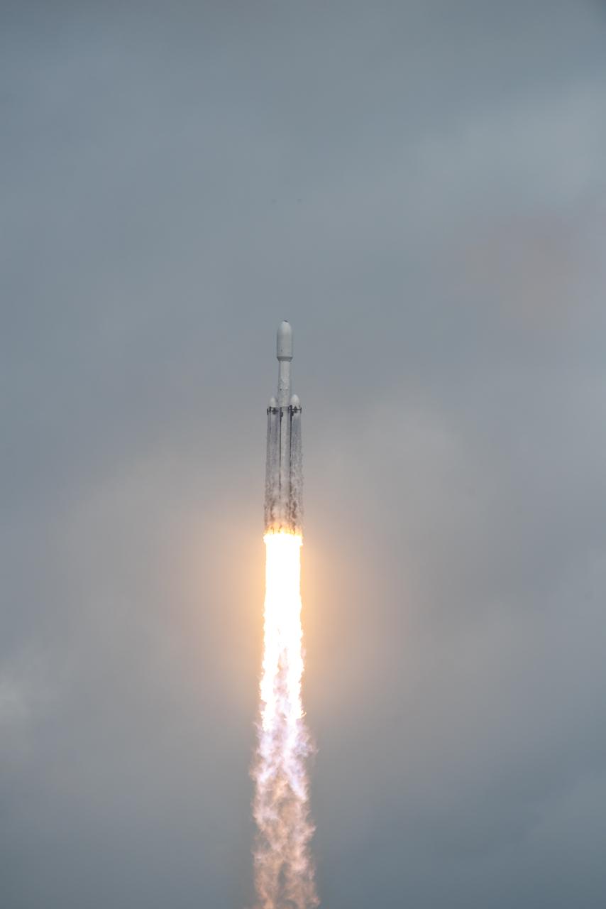 NASA’s Psyche spacecraft, atop a SpaceX Falcon Heavy rocket, lifts off from Kennedy Space Center’s historic Launch Complex 39A in Florida at 10:19 a.m. EDT on Friday, Oct. 13, 2023. The Psyche mission will study a metal-rich asteroid with the same name, located in the main asteroid belt between Mars and Jupiter. This is NASA’s first mission to study an asteroid that has more metal than rock or ice. Riding with Psyche is a pioneering technology demonstration – NASA’s Deep Space Optical Communications (DSOC) experiment – which will be the first test of laser communications beyond the Moon.