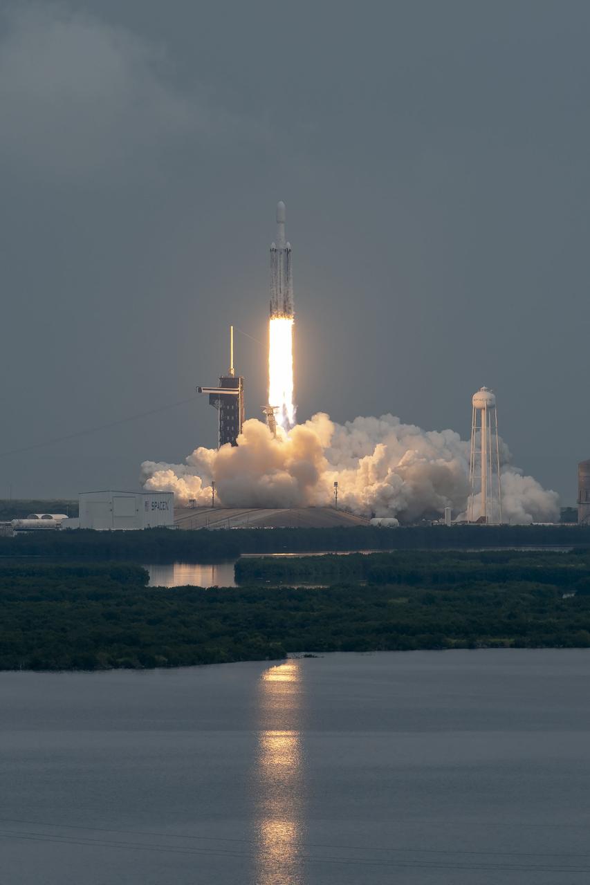 NASA’s Psyche spacecraft, atop a SpaceX Falcon Heavy rocket, lifts off from Kennedy Space Center’s historic Launch Complex 39A in Florida at 10:19 a.m. EDT on Friday, Oct. 13, 2023. The Psyche mission will study a metal-rich asteroid with the same name, located in the main asteroid belt between Mars and Jupiter. This is NASA’s first mission to study an asteroid that has more metal than rock or ice. Riding with Psyche is a pioneering technology demonstration – NASA’s Deep Space Optical Communications (DSOC) experiment – which will be the first test of laser communications beyond the Moon.