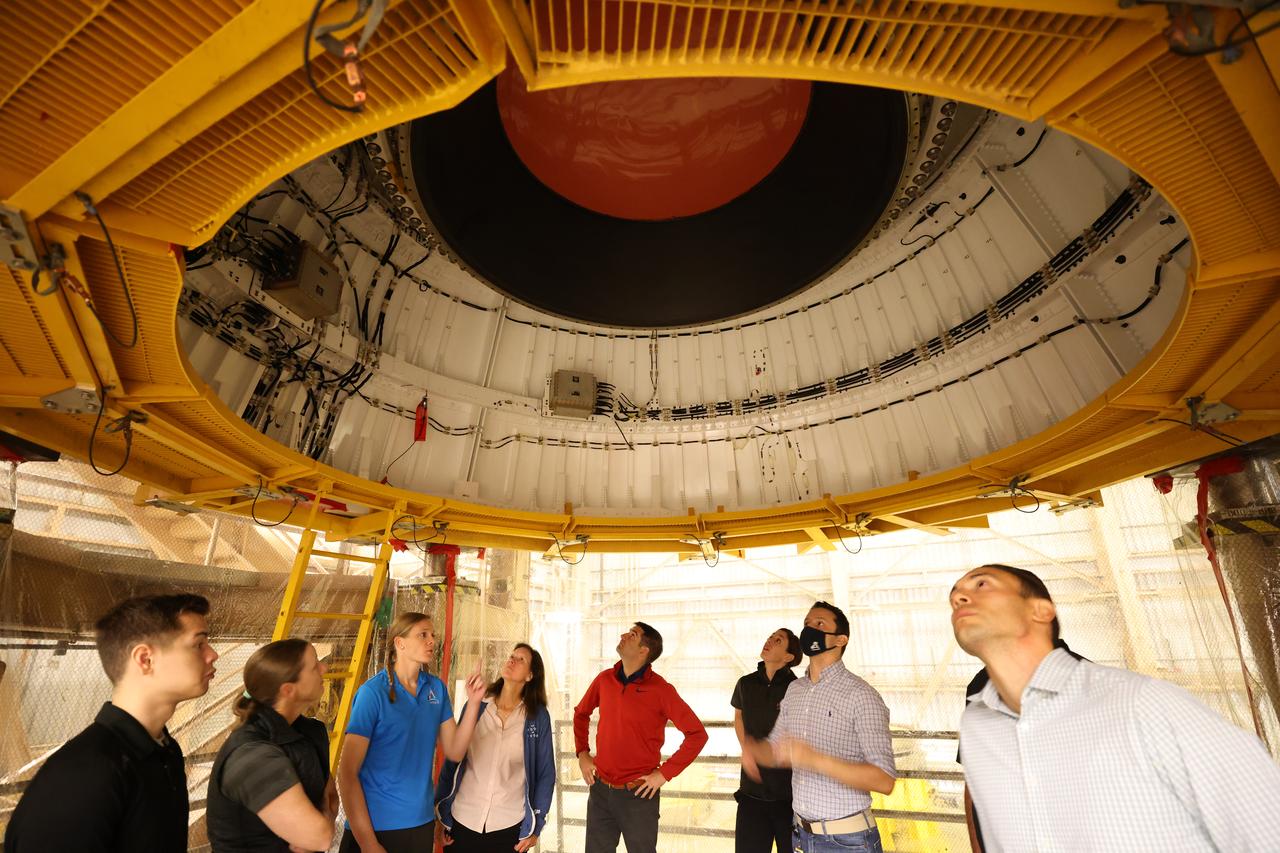 NASA’s 2021 class of astronaut candidates view a booster segment for Artemis II inside the Rotation, Processing and Surge Facility during a familiarization tour of facilities on Tuesday, Oct. 17, 2023, at the agency’s Kennedy Space Center in Florida. 