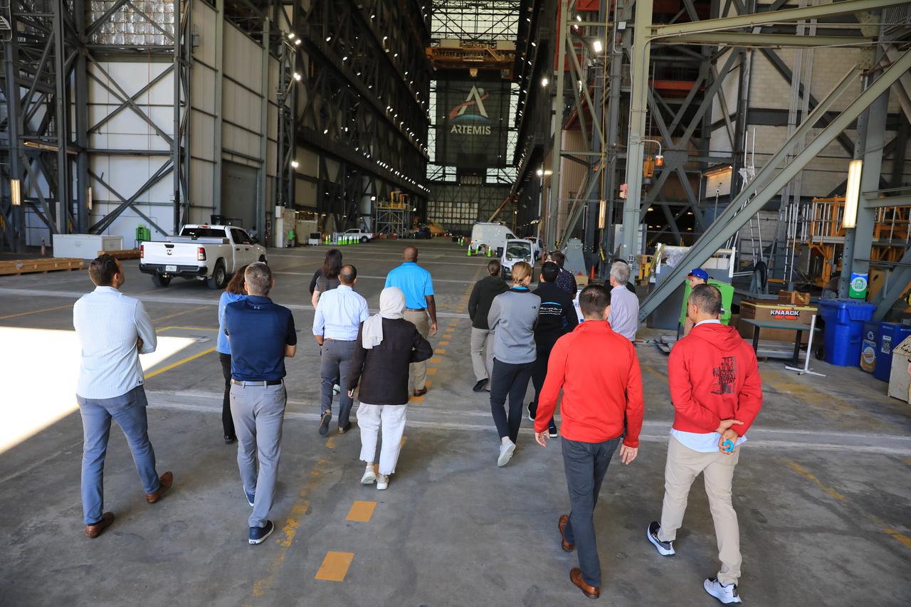 NASA’s 2021 class of astronaut candidates walk inside the Vehicle Assembly Building during a familiarization tour of facilities on Tuesday, Oct. 17, 2023, at the agency’s Kennedy Space Center in Florida. 