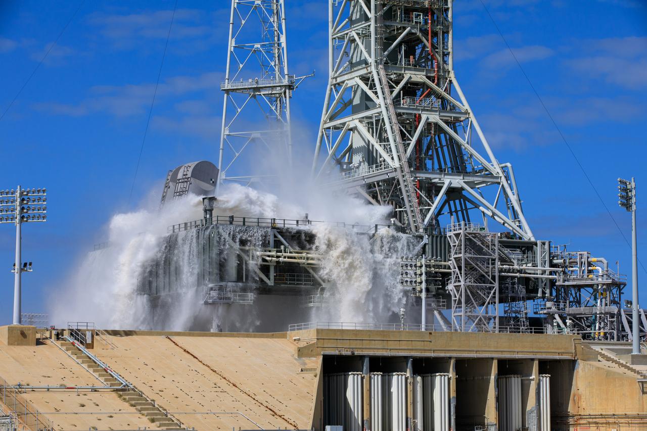 NASA’s Exploration Ground Systems conducts a water flow test with the mobile launcher at Kennedy Space Center’s Launch Complex 39B in Florida on Oct. 24, 2023. It is the third in a series of tests to verify the overpressure protection and sound suppression system is ready for launch of the Artemis II mission. During liftoff, 400,000 gallons of water will rush onto the pad to help protect NASA’s SLS (Space Launch System) rocket, Orion spacecraft, mobile launcher, and launch pad from any over pressurization and extreme sound produced during ignition and liftoff.
