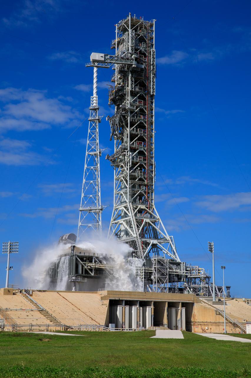 NASA’s Exploration Ground Systems conducts a water flow test with the mobile launcher at Kennedy Space Center’s Launch Complex 39B in Florida on Oct. 24, 2023. It is the third in a series of tests to verify the overpressure protection and sound suppression system is ready for launch of the Artemis II mission. During liftoff, 400,000 gallons of water will rush onto the pad to help protect NASA’s SLS (Space Launch System) rocket, Orion spacecraft, mobile launcher, and launch pad from any over pressurization and extreme sound produced during ignition and liftoff.