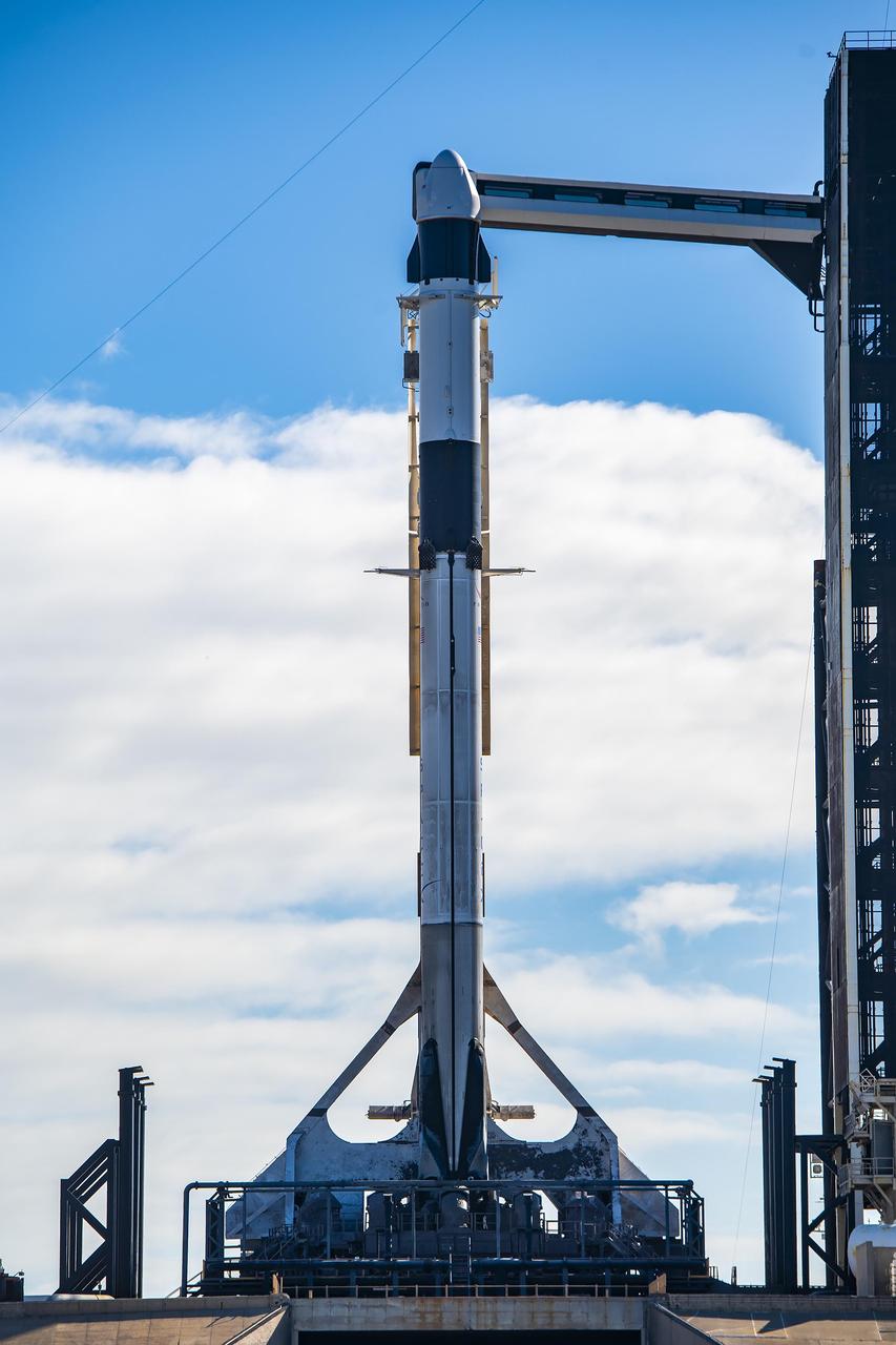 In preparation for SpaceX’s 29th commercial resupply services launch to the International Space Station for NASA, the company’s Falcon 9 rocket, with the Dragon spacecraft atop, is raised to a vertical position at Kennedy Space Center’s Launch Complex 39A in Florida on Wednesday, Nov. 8, 2023. The mission will carry scientific research, technology demonstrations, crew supplies, and hardware to the space station to support its Expedition 70 crew, including NASA’s Integrated Laser Communications Relay Demonstration Low Earth Orbit User Modem and Amplifier Terminal (ILLUMA-T) and Atmospheric Waves Experiment (AWE). Liftoff is scheduled for 8:28 p.m. EST Thursday, Nov. 9, from Kennedy’s Launch Complex 39A.