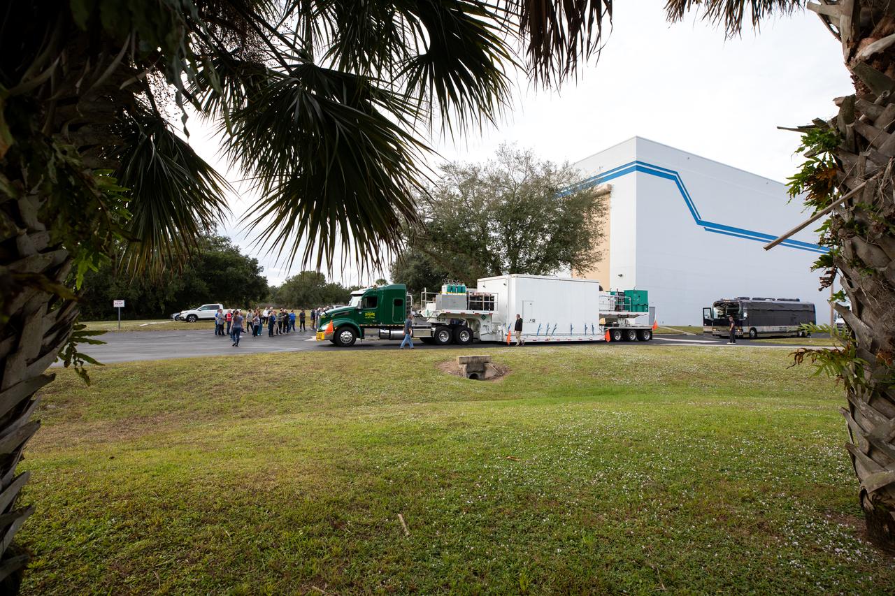 The transport carrier containing NASA’s Plankton, Aerosol, Cloud, ocean Ecosystem (PACE) observatory spacecraft arrives at the Astrotech Space Operations Facility near the agency’s Kennedy Space Center in Florida on Tuesday, Nov. 14, 2023. PACE was shipped from the agency’s Goddard Space Flight Center in Greenbelt, Maryland, and is targeted to launch on January 30, 2024, on a SpaceX Falcon 9 rocket lifting off from Space Launch Complex 40 at Cape Canaveral Space Force Station. The PACE observatory will help us better understand how the ocean and atmosphere exchange carbon dioxide, measure key atmospheric variables associated with air quality and Earth's climate, and monitor ocean health, in part by studying phytoplankton, tiny plants and algae that sustain the marine food web. 