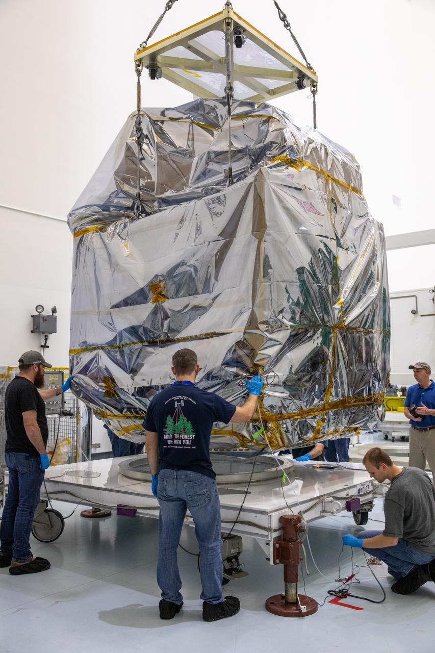 NASA’s Plankton, Aerosol, Cloud, ocean Ecosystem (PACE) observatory spacecraft is uncrated for prelaunch processing at the Astrotech Space Operations Facility near the agency’s Kennedy Space Center in Florida on Wednesday, Nov. 15, 2023. The PACE observatory will help us better understand how the ocean and atmosphere exchange carbon dioxide, measure key atmospheric variables associated with air quality and Earth's climate, and monitor ocean health, in part by studying phytoplankton, tiny plants and algae that sustain the marine food web. PACE will be encapsulated for launch aboard a SpaceX Falcon 9 rocket from Space Launch Complex 40 at Cape Canaveral Space Force Station in Florida.