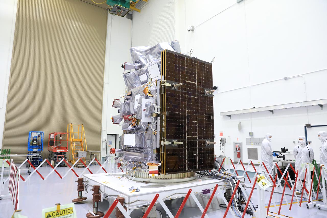 Technicians work to process the NASA’s Plankton, Aerosol, Cloud, ocean Ecosystem (PACE) observatory on a spacecraft dolly in a high bay at the Astrotech Space Operations Facility near the agency’s Kennedy Space Center in Florida on Monday, Dec. 4, 2023. PACE will extend and improve upon NASA’s 20-plus years of global satellite observations of our living ocean, atmospheric aerosols, and clouds. It will also continue key measurements related to air quality and initiate an advanced set of climate-relevant data records. PACE will be encapsulated for launch aboard a SpaceX Falcon 9 rocket in early 2024 from Space Launch Complex 40 at Cape Canaveral Space Force Station in Florida.