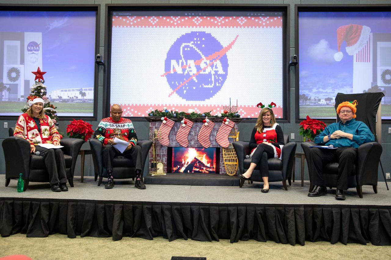 From left, NASA’s Kennedy Space Center Director Janet Petro, Kennedy Space Center Deputy Director Kelvin Manning, Kennedy Space Center Associate Director, Technical, Jennifer Kunz, and Kennedy Space Center Associate Director of Management Burt Summerfield participate in an employee town hall meeting held on Thursday, Dec. 7, 2023, at Kennedy’s Operations Support Building II. Kennedy’s executive leadership team donned holiday sweaters and competed for the title of “most festive” as they provided updates on center milestones, celebrated the year’s achievements, and answered questions from the workforce.  
