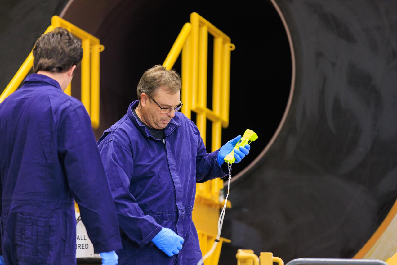 Technicians with Exploration Ground Systems, based at NASA’s Kennedy Space Center in Florida, perform propellant grain inspections on two of the agency’s Space Launch System solid rocket booster segments for the Artemis II campaign on Wednesday, Dec. 20, 2023, inside the Rotation, Processing and Surge Facility. The team is inspecting the propellant   of all 10 booster segments before they are rotated vertically for processing. The Artemis II mission will send four astronauts around the Moon as part of the agency’s effort to establish a long-term science and exploration presence at the Moon, and eventually Mars. 