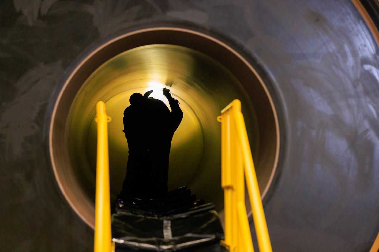 Technicians with Exploration Ground Systems, based at NASA’s Kennedy Space Center in Florida, perform propellant grain inspections on two of the agency’s Space Launch System solid rocket booster segments for the Artemis II campaign on Wednesday, Dec. 20, 2023, inside the Rotation, Processing and Surge Facility. The team is inspecting the propellant   of all 10 booster segments before they are rotated vertically for processing. The Artemis II mission will send four astronauts around the Moon as part of the agency’s effort to establish a long-term science and exploration presence at the Moon, and eventually Mars. 