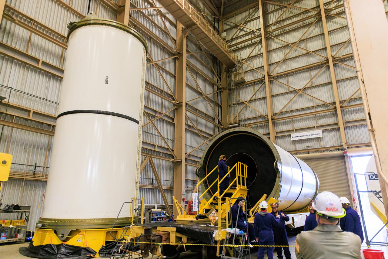 Technicians with Exploration Ground Systems, based at NASA’s Kennedy Space Center in Florida, perform propellant grain inspections on two of the agency’s Space Launch System solid rocket booster segments for the Artemis II campaign on Wednesday, Dec. 20, 2023, inside the Rotation, Processing and Surge Facility. The team is inspecting the propellant   of all 10 booster segments before they are rotated vertically for processing. The Artemis II mission will send four astronauts around the Moon as part of the agency’s effort to establish a long-term science and exploration presence at the Moon, and eventually Mars. 