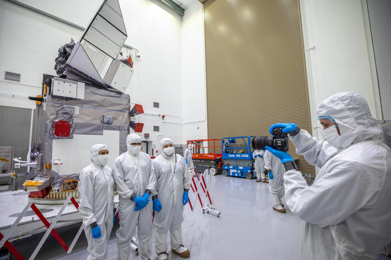 Members of NASA’s PACE (Plankton, Aerosol, Cloud, ocean Ecosystem) team are photographed with the spacecraft on Wednesday, Jan. 3, 2024, during a NASA-hosted media day inside a cleanroom at the Astrotech Space Operations Facility near NASA’s Kennedy Space Center in Florida. PACE will collect data on how the ocean and atmosphere exchange carbon dioxide, measure key atmospheric variables associated with air quality and Earth's climate, and monitor ocean health. PACE is set to launch aboard a SpaceX Falcon 9 rocket no earlier than Tuesday, Feb. 6, 2024, from Space Launch Complex 40 at Cape Canaveral Space Force Station in Florida.