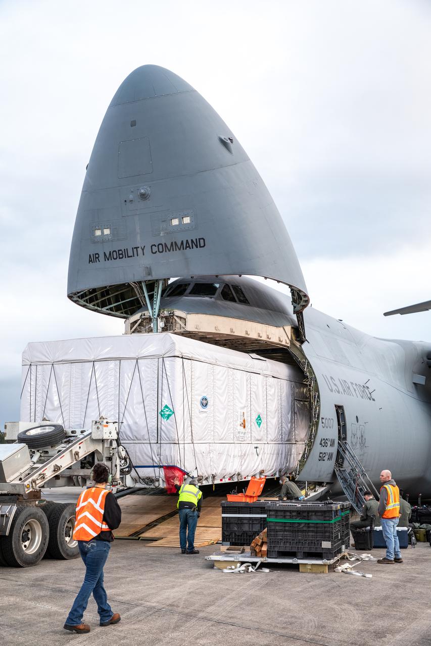 NOAA’s Geostationary Operational Environmental Satellite-U (GOES-U) is offloaded from a C-5M Super Galaxy transport aircraft onto the flatbed of a heavy-lift truck at the Launch and Landing Facility at NASA’s Kennedy Space Center in Florida on Tuesday, Jan. 23, 2024. Crews transported the satellite to the Astrotech Space Operations facility in Titusville, Florida to prepare it for launch. Part of a collaborative NOAA and NASA program, GOES-U is the fourth in a series of four advanced geostationary weather satellites. Data from the GOES satellite constellation – consisting of the GOES-R, GOES-S, GOES-T and GOES-U spacecraft – enables forecasters to predict, observe, and track local weather events that affect public safety like thunderstorms, hurricanes, and wildfires.