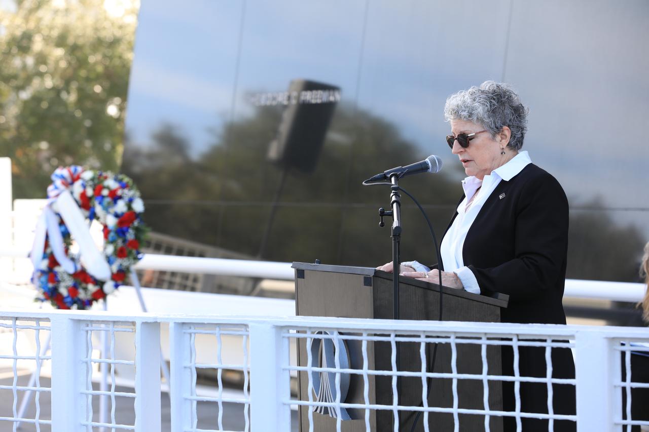 Astronauts Memorial Foundation board member Karen Bassett Stevenson and daughter of Charles Bassett II, delivers remarks honoring fallen astronauts who lost their lives while furthering the cause of exploration and discovery during NASA’s annual Day of Remembrance on Thursday, Jan. 25, 2024, at the Space Mirror Memorial at the agency’s Kennedy Space Center Visitor Complex in Florida. Those remembered include the crews of Apollo 1, Challenger STS-51L, and Columbia STS-107.