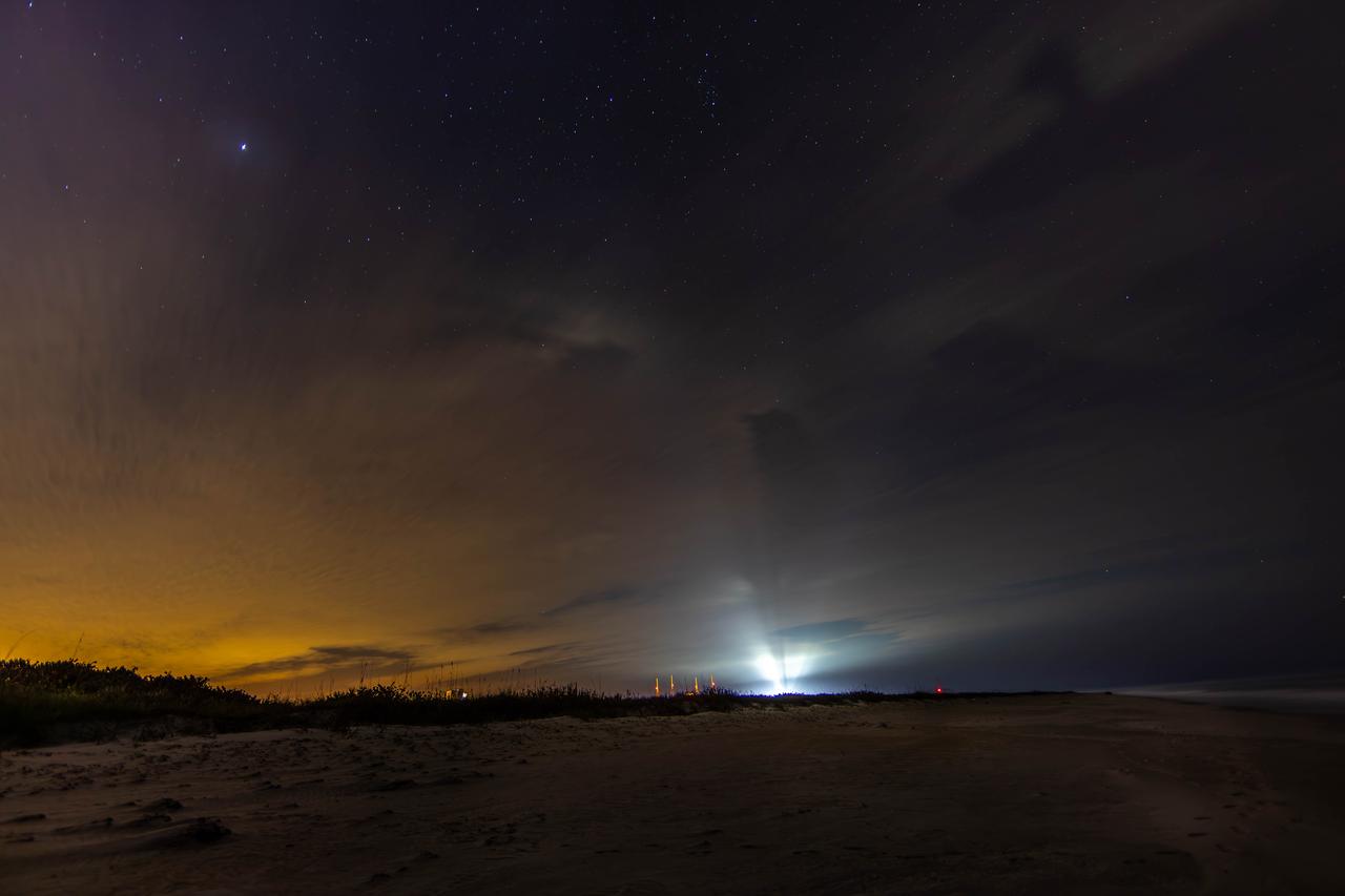 Photographers at NASA capture the night sky Tuesday, Jan. 30, 2024, on a beach near the agency’s Kennedy Space Center in Florida.