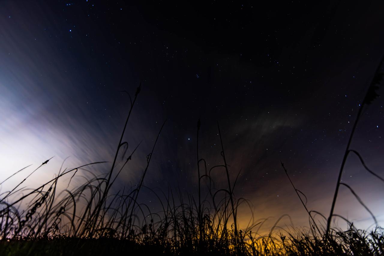 Photographers at NASA capture the night sky Tuesday, Jan. 30, 2024, on a beach near the agency’s Kennedy Space Center in Florida.