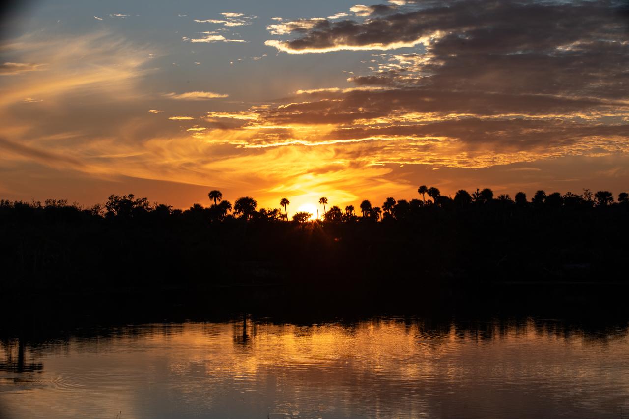 Photographers at NASA capture the sunset on Tuesday, Jan. 30, 2024, at the agency’s Kennedy Space Center in Florida.