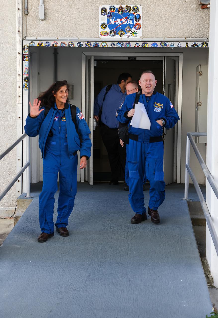 NASA astronauts Suni Williams and Barry “Butch” Wilmore emerge from the Neil Armstrong Operations and Checkout Building at the agency’s Kennedy Space Center in Florida on Wednesday, Jan. 31, 2024, as part of an integrated crew exercise simulation for NASA’s Boeing Crew Flight Test (CFT). The integrated exercise involved participation from the flight crew, NASA, Boeing, and United Launch Alliance (ULA), and allowed teams to rehearse prelaunch operations beginning roughly four hours before a targeted liftoff. CFT will be the first flight with astronauts to the International Space Station for Boeing’s Starliner spacecraft as part of NASA’s Commercial Crew Program. Starliner is scheduled to launch atop ULA’s Atlas V rocket no earlier than mid-April 2024.