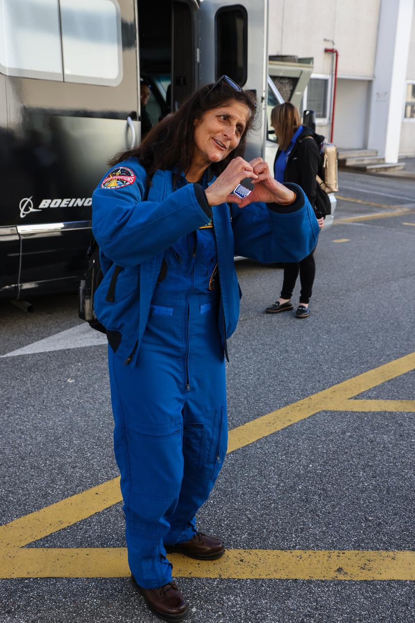 NASA astronaut Suni Williams emerges from the Neil Armstrong Operations and Checkout Building at the agency’s Kennedy Space Center in Florida on Wednesday, Jan. 31, 2024, as part of an integrated crew exercise simulation for NASA’s Boeing Crew Flight Test (CFT). Williams and fellow crew member Barry “Butch” Wilmore, along with NASA, Boeing, and United Launch Alliance (ULA), participated in the integrated exercise, which allowed teams to rehearse prelaunch operations beginning roughly four hours before a targeted liftoff. CFT will be the first flight with astronauts to the International Space Station for Boeing’s Starliner spacecraft as part of NASA’s Commercial Crew Program. Starliner is scheduled to launch atop ULA’s Atlas V rocket no earlier than mid-April 2024.