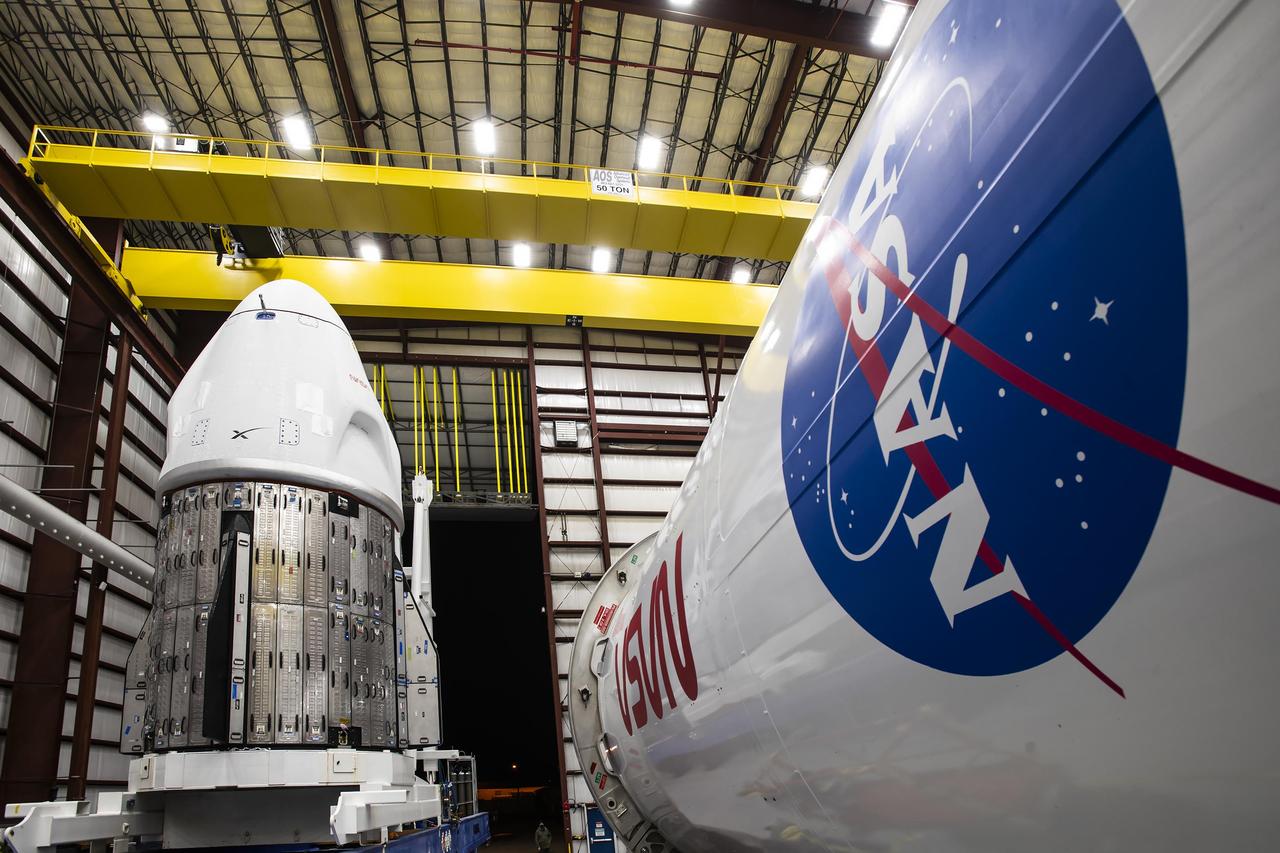Inside the SpaceX horizontal processing facility at Launch Complex 39A at NASA’s Kennedy Space Center in Florida, the company's Dragon spacecraft is pictured next to a Falcon 9 rocket on Monday, Feb. 19, 2024, prior to integration for NASA’s SpaceX Crew-8 mission to the International Space Station. Liftoff of the eighth crew rotation mission with SpaceX to the station, and the ninth flight of Dragon with people as part of the agency’s Commercial Crew Program is slated for no earlier than 12:04 a.m. EST on Friday, March 1.