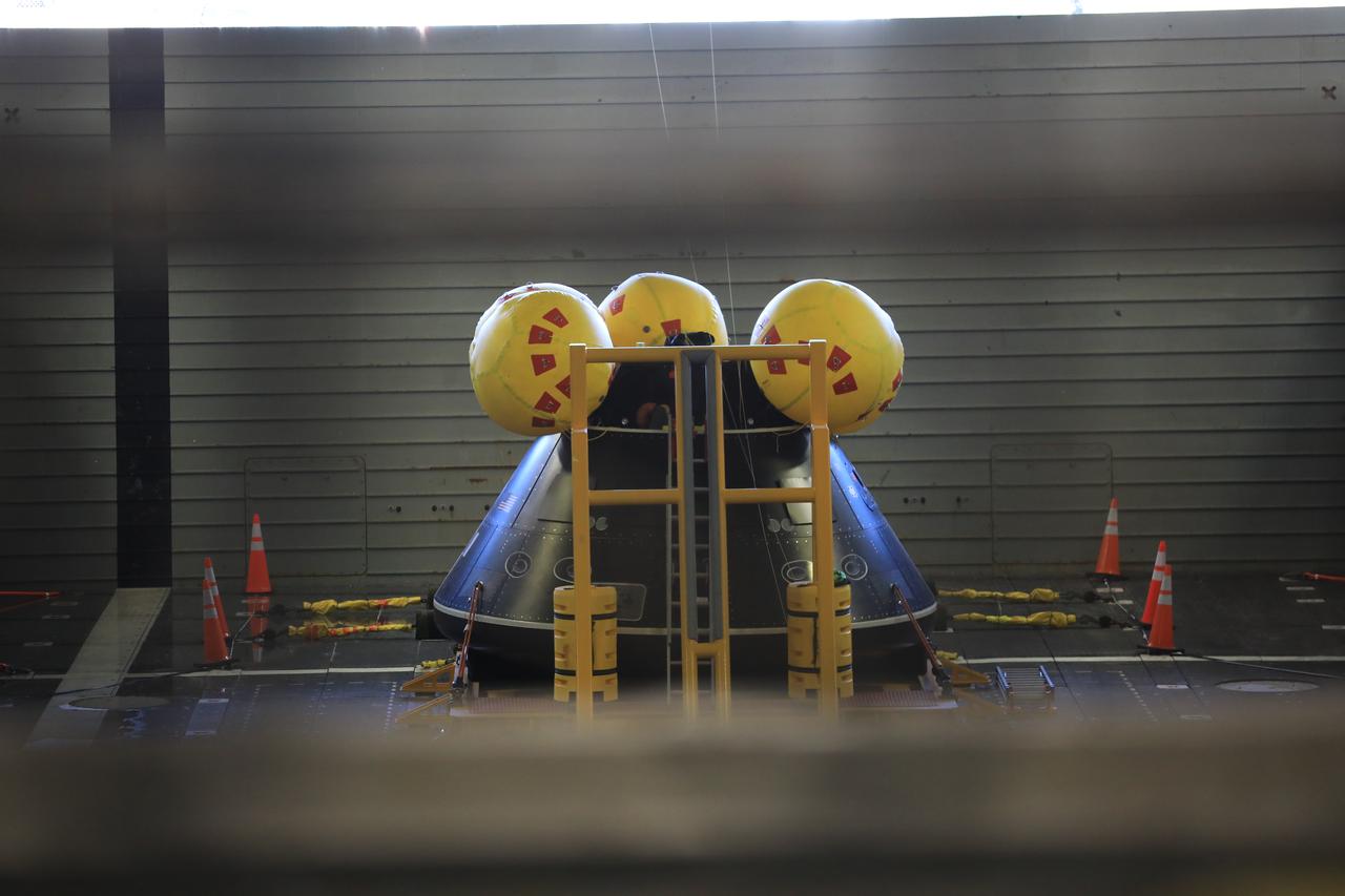 Members of NASA’s Exploration Ground System’s Landing and Recovery team and partners from the Department of Defense aboard the USS San Diego participate in a ship rider briefing on the flight deck prior to departure from Naval Base San Diego on Feb. 21. During this test campaign, teams will practice recovery procedures using the Crew Module Test Article, during Underway Recovery Test 11 (URT-11) off the coast of San Diego. URT-11 is the eleventh in a series of Artemis recovery tests, but the first time NASA and its partners from the Department of Defense put their Artemis II recovery procedures to the test with the astronauts.