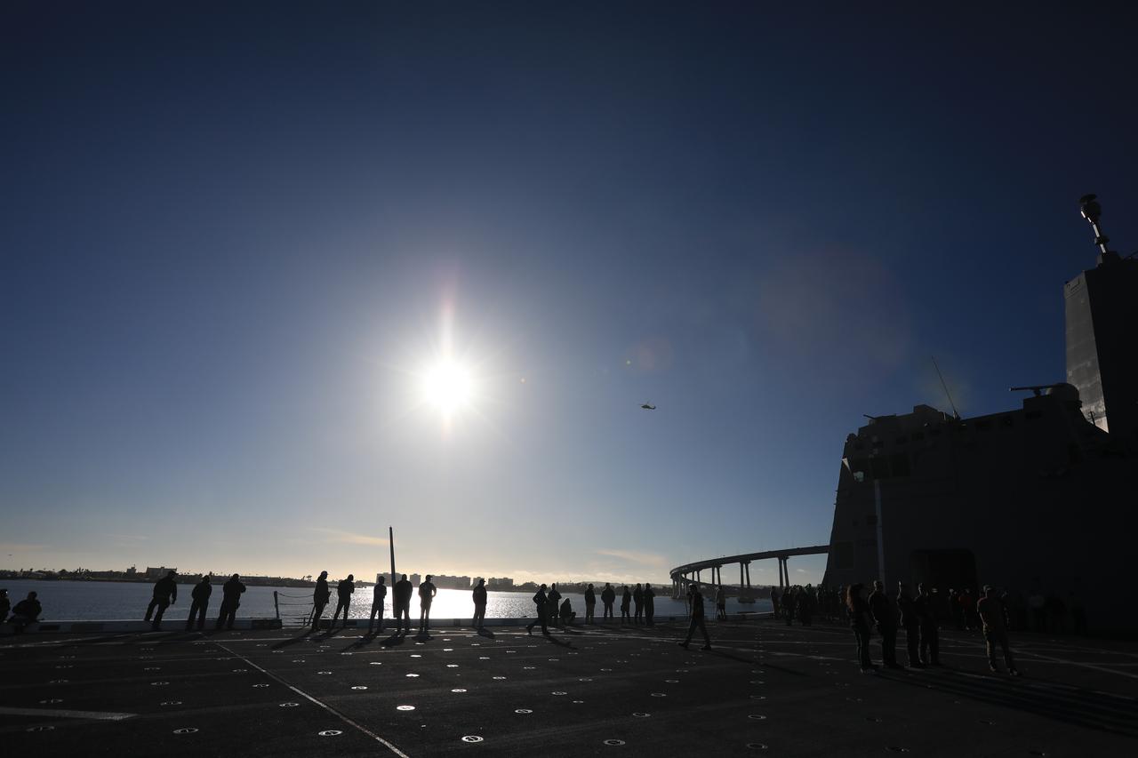 Members of NASA’s Exploration Ground System’s Landing and Recovery team and partners from the Department of Defense aboard the USS San Diego participate in a ship rider briefing on the flight deck prior to departure from Naval Base San Diego on Feb. 21. During this test campaign, teams will practice recovery procedures using the Crew Module Test Article, during Underway Recovery Test 11 (URT-11) off the coast of San Diego. URT-11 is the eleventh in a series of Artemis recovery tests, but the first time NASA and its partners from the Department of Defense put their Artemis II recovery procedures to the test with the astronauts.