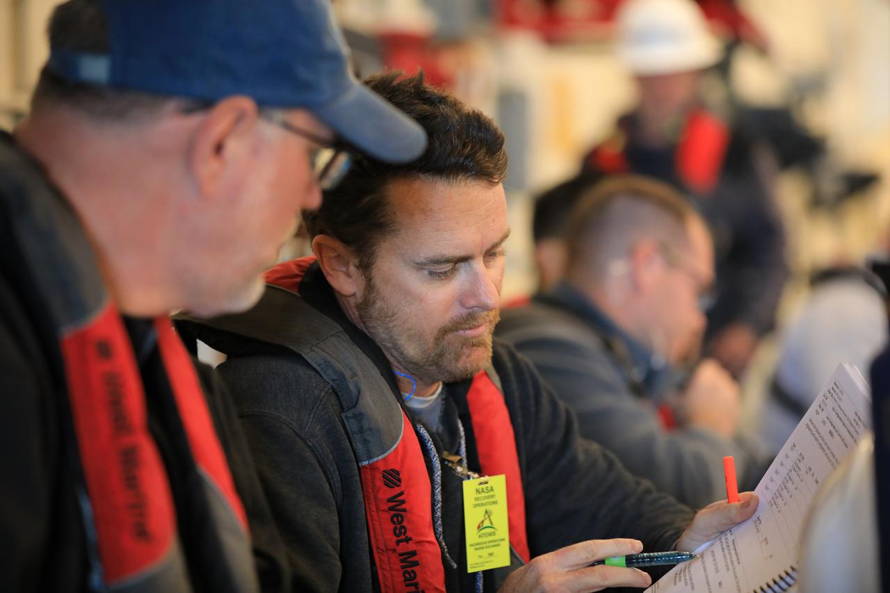 Members of NASA’s Exploration Ground System’s Landing and Recovery team and partners from the Department of Defense aboard the USS San Diego monitor operations of the day in the ship’s well deck and practice recovery procedures using the Crew Module Test Article, during Underway Recovery Test 11 (URT-11) off the coast of San Diego on Thursday, Feb. 22, 2024. URT-11 is the eleventh in a series of Artemis recovery tests, and the first time NASA and its partners put their Artemis II recovery procedures to the test with the astronauts.