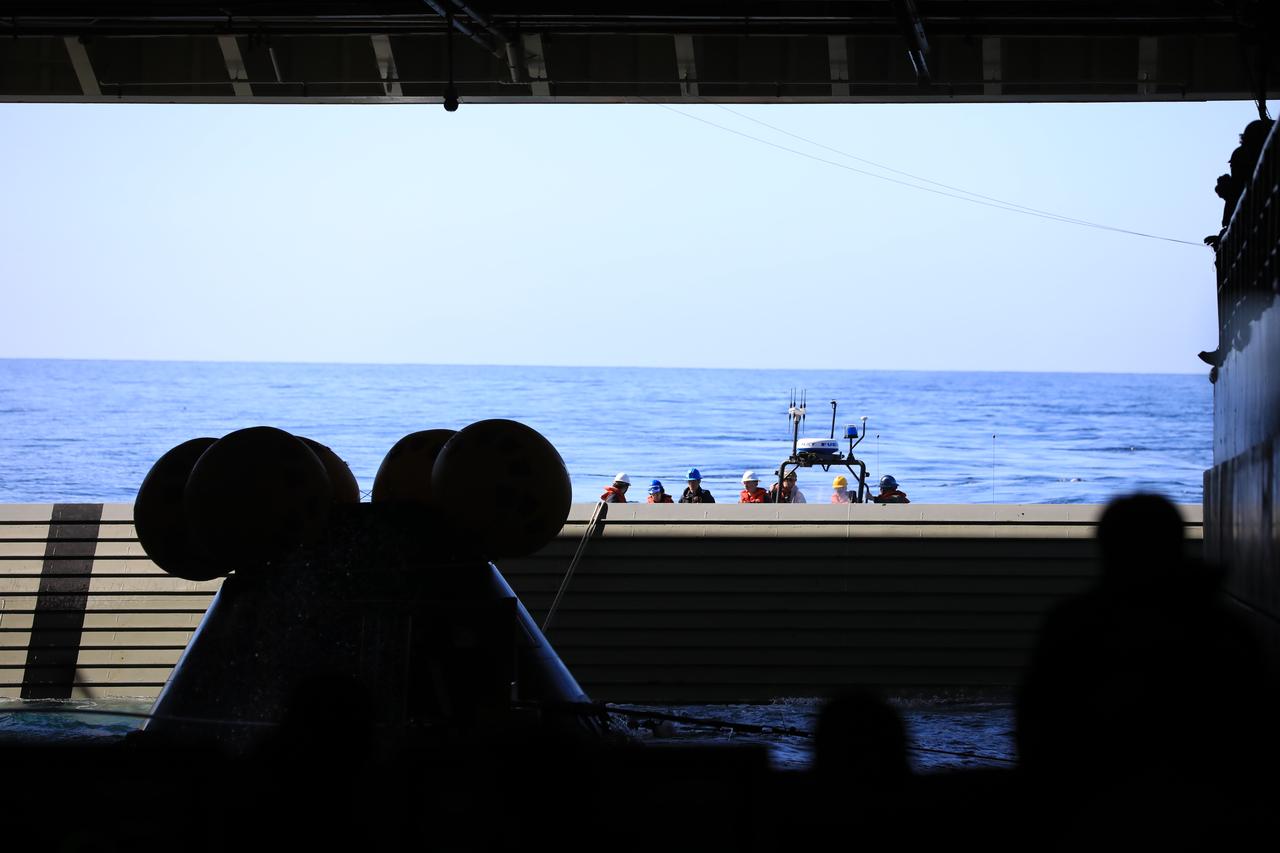 Members of NASA’s Exploration Ground System’s Landing and Recovery team and partners from the Department of Defense aboard the USS San Diego practice recovery procedures during Underway Recovery Test 11 (URT-11) off the coast of San Diego on Thursday, Feb. 22, 2024. The team works to secure the Crew Module Test Article and align it on its stand inside the ship’s well deck. URT-11 is the eleventh in a series of Artemis recovery tests, and the first time NASA and its partners put their Artemis II recovery procedures to the test with the astronauts.