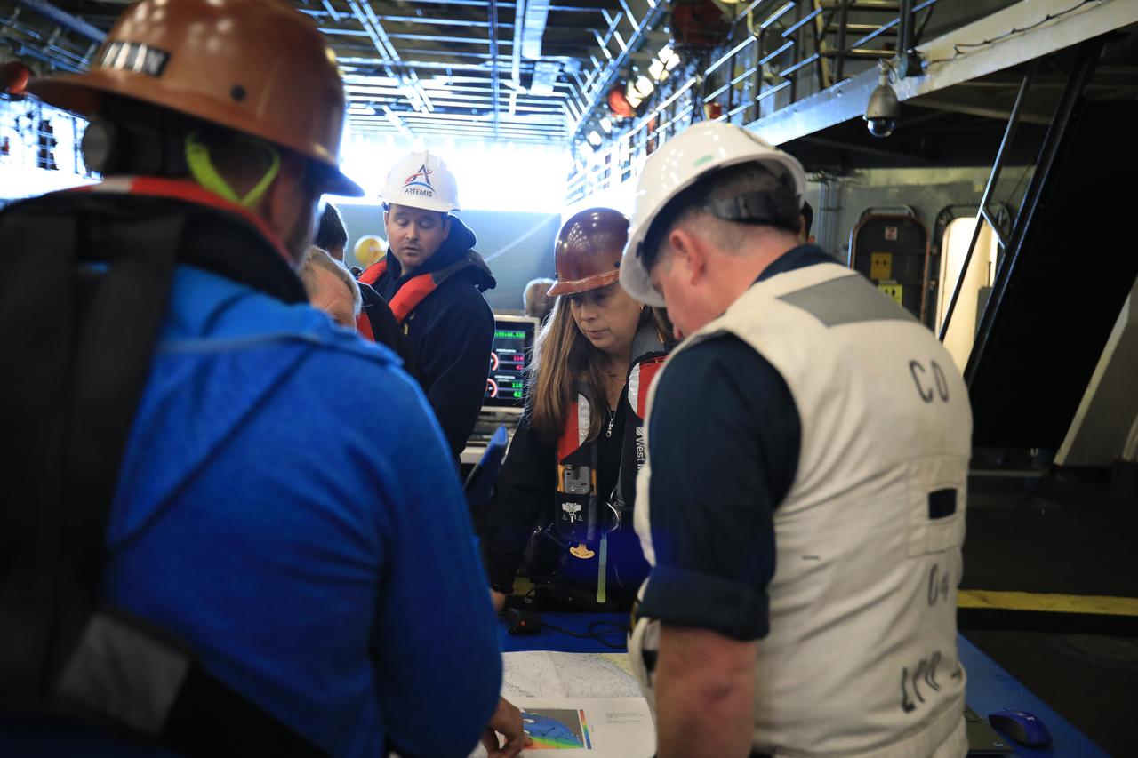 Members of NASA’s Exploration Ground System’s Landing and Recovery team and partners from the Department of Defense aboard the USS San Diego monitor operations of the day in the ship’s well deck and practice recovery procedures using the Crew Module Test Article, during Underway Recovery Test 11 (URT-11) off the coast of San Diego on Thursday, Feb. 22, 2024. URT-11 is the eleventh in a series of Artemis recovery tests, and the first time NASA and its partners put their Artemis II recovery procedures to the test with the astronauts.