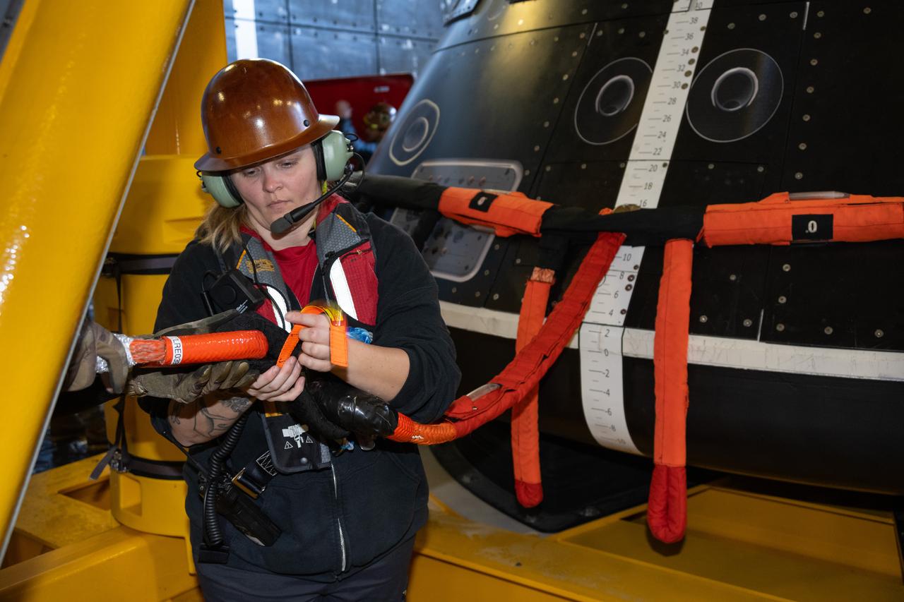 Members of NASA’s Exploration Ground System’s Landing and Recovery team and partners from the Department of Defense aboard the USS San Diego secure the Crew Module Test Article on its stand in the ship’s well deck while practicing recovery procedures during Underway Recovery Test 11 (URT-11) off the coast of San Diego on Thursday, Feb. 22, 2024. URT-11 is the eleventh in a series of Artemis recovery tests, and the first time NASA and its partners put their Artemis II recovery procedures to the test with the astronauts.