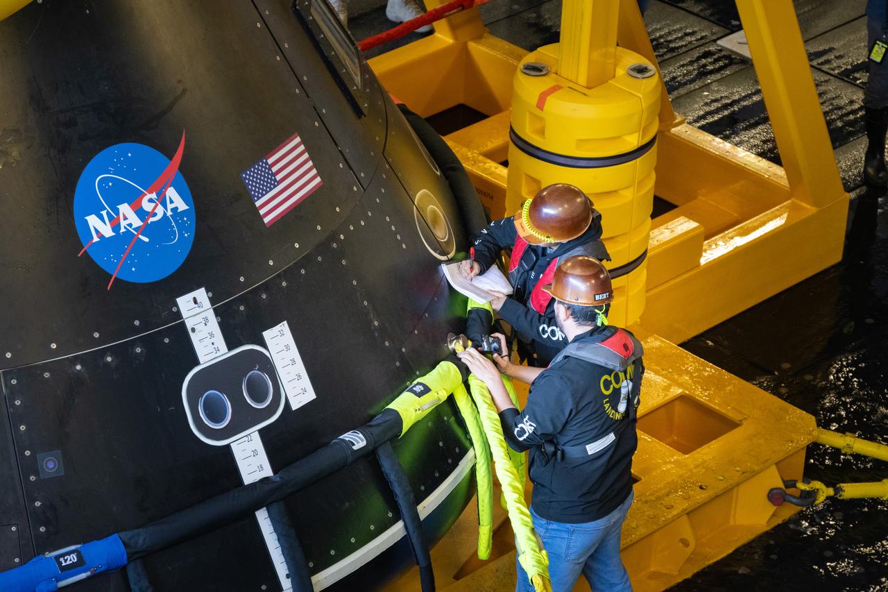 Members of NASA’s Exploration Ground System’s Landing and Recovery team and partners from the Department of Defense aboard the USS San Diego secure the Crew Module Test Article on its stand in the ship’s well deck while practicing recovery procedures during Underway Recovery Test 11 (URT-11) off the coast of San Diego on Thursday, Feb. 22, 2024. URT-11 is the eleventh in a series of Artemis recovery tests, and the first time NASA and its partners put their Artemis II recovery procedures to the test with the astronauts.