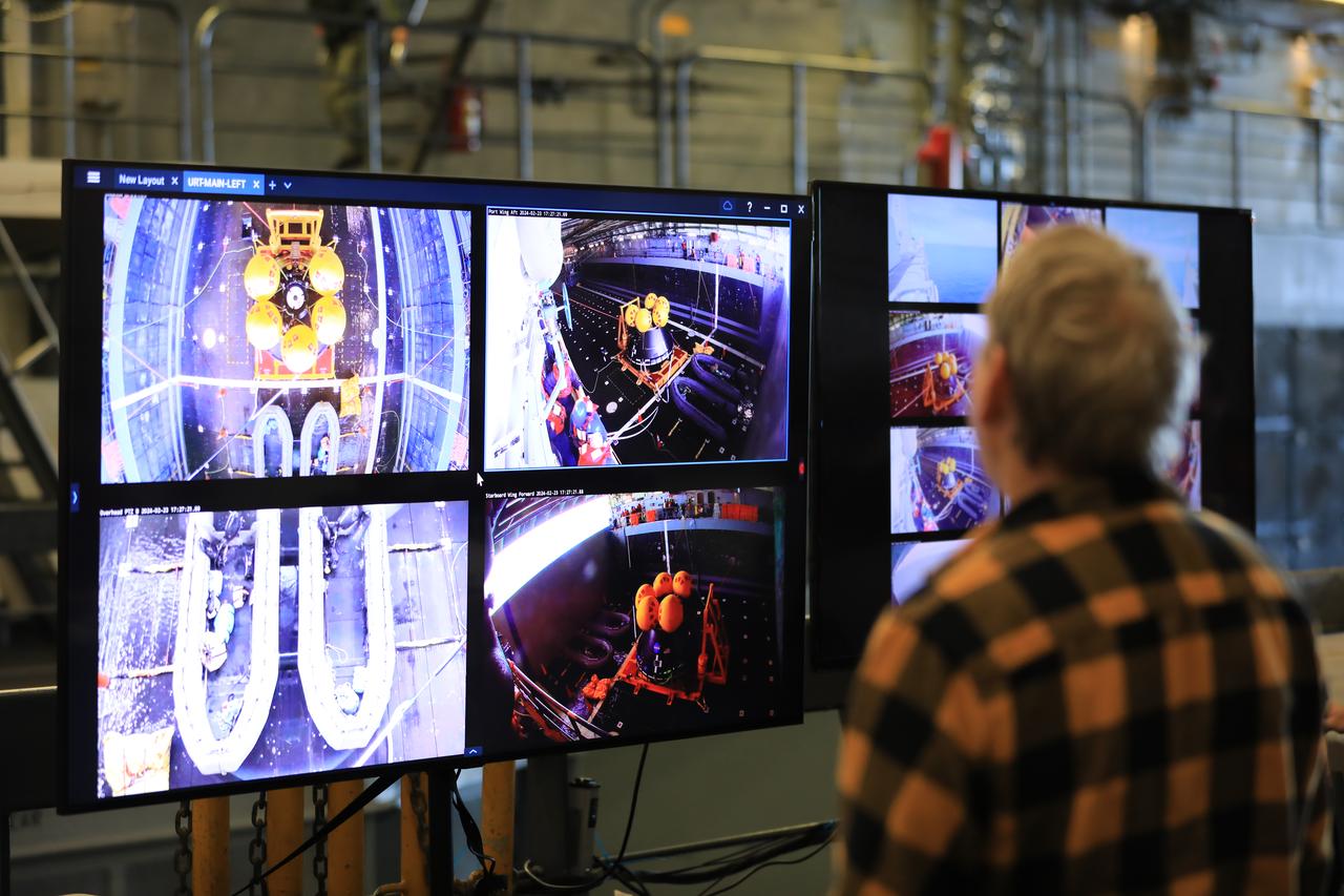Members of NASA’s Exploration Ground System’s Landing and Recovery team and partners from the Department of Defense aboard the USS San Diego monitor operations of the day in the ship’s well deck and practice recovery procedures using the Crew Module Test Article, during Underway Recovery Test 11 (URT-11) off the coast of San Diego on Friday, Feb. 23, 2024. URT-11 is the eleventh in a series of Artemis recovery tests, and the first time NASA and its partners put their Artemis II recovery procedures to the test with the astronauts.