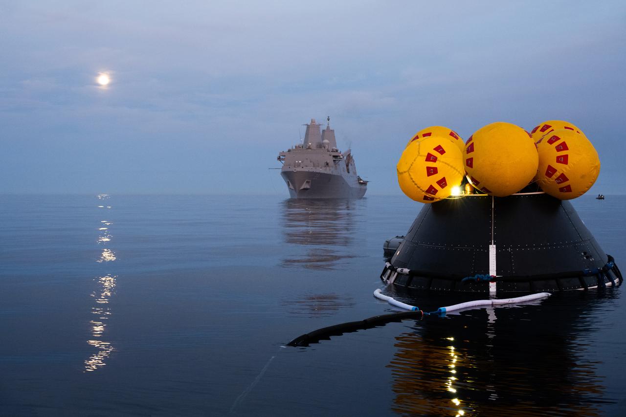 During sunrise over the Pacific Ocean, members of NASA’s Exploration Ground System’s Landing and Recovery team and partners from the Department of Defense aboard the USS San Diego practice recovery procedures using the Crew Module Test Article during Underway Recovery Test 11 (URT-11) off the coast of San Diego on Friday, Feb. 23, 2024. URT-11 is the eleventh in a series of Artemis recovery tests, and the first time NASA and its partners put their Artemis II recovery procedures to the test with the astronauts.