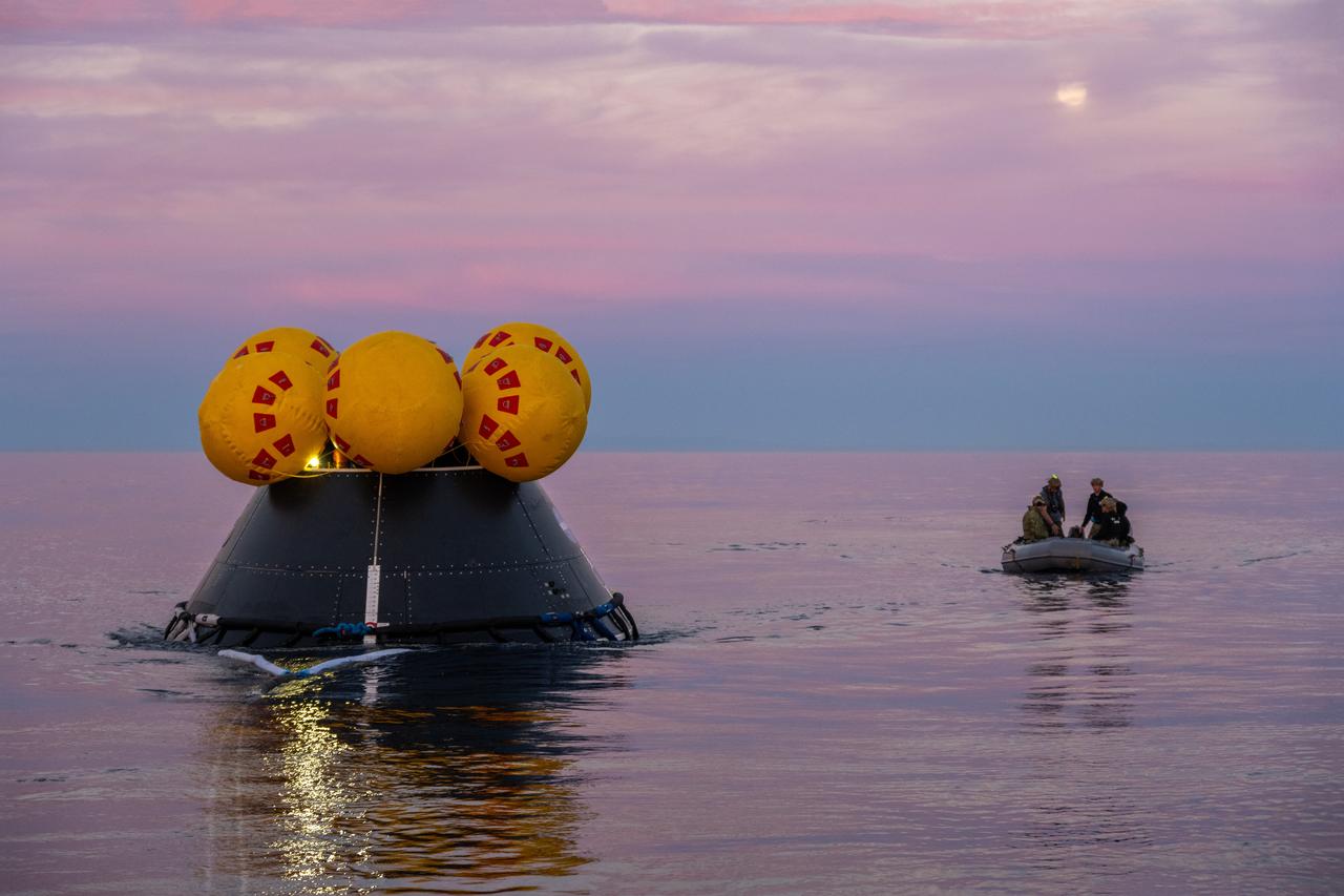 During sunrise over the Pacific Ocean, members of NASA’s Exploration Ground System’s Landing and Recovery team and partners from the Department of Defense aboard the USS San Diego practice recovery procedures using the Crew Module Test Article during Underway Recovery Test 11 (URT-11) off the coast of San Diego on Friday, Feb. 23, 2024. URT-11 is the eleventh in a series of Artemis recovery tests, and the first time NASA and its partners put their Artemis II recovery procedures to the test with the astronauts.