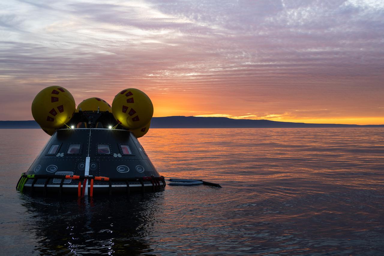 During sunrise over the Pacific Ocean, members of NASA’s Exploration Ground System’s Landing and Recovery team and partners from the Department of Defense aboard the USS San Diego practice recovery procedures using the Crew Module Test Article during Underway Recovery Test 11 (URT-11) off the coast of San Diego on Friday, Feb. 23, 2024. URT-11 is the eleventh in a series of Artemis recovery tests, and the first time NASA and its partners put their Artemis II recovery procedures to the test with the astronauts.