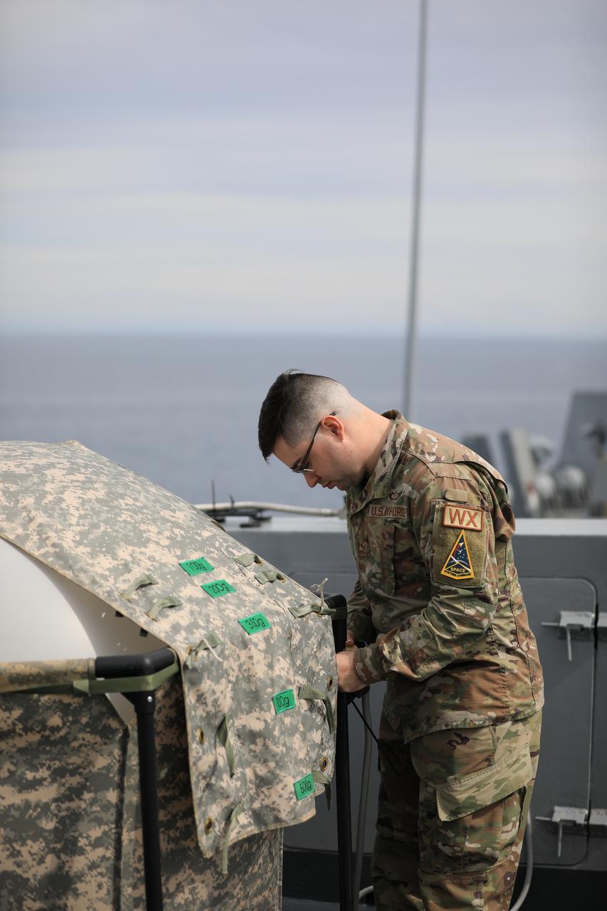 Members of NASA’s Exploration Ground System’s Landing and Recovery team and partners from the Department of Defense aboard the USS San Diego release a weather balloon while practicing recovery procedures using the Crew Module Test Article during Underway Recovery Test 11 (URT-11) off the coast of San Diego on Saturday, Feb. 24, 2024. URT-11 is the eleventh in a series of Artemis recovery tests, and the first time NASA and its partners put their Artemis II recovery procedures to the test with the astronauts.