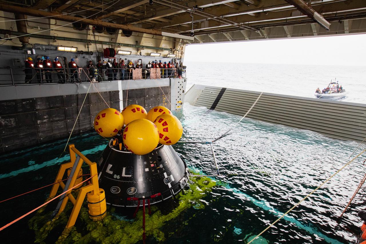 NASA’s Exploration Ground System’s Landing and Recovery team and partners from the Department of Defense aboard the USS San Diego practice recovery procedures using the Crew Module Test Article, during Underway Recovery Test 11 (URT-11) off the coast of San Diego, California on Sunday, Feb. 25, 2024. URT-11 is the eleventh in a series of Artemis recovery tests, and the first time NASA and its partners put their Artemis II recovery procedures to the test with the astronauts.