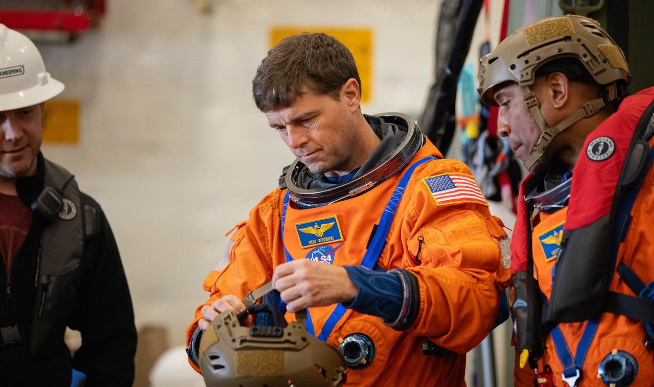 Artemis II crew members NASA astronauts Reid Wiseman (left) and Victor Glover (right) join NASA’s Exploration Ground System’s Landing and Recovery team and partners from the Department of Defense aboard the USS San Diego practicing recovery procedures using the Crew Module Test Article, during Underway Recovery Test 11 (URT-11) off the coast of San Diego, California on Sunday, Feb. 25, 2024. URT-11 is the eleventh in a series of Artemis recovery tests, and the first time NASA and its partners put their Artemis II recovery procedures to the test with the astronauts.