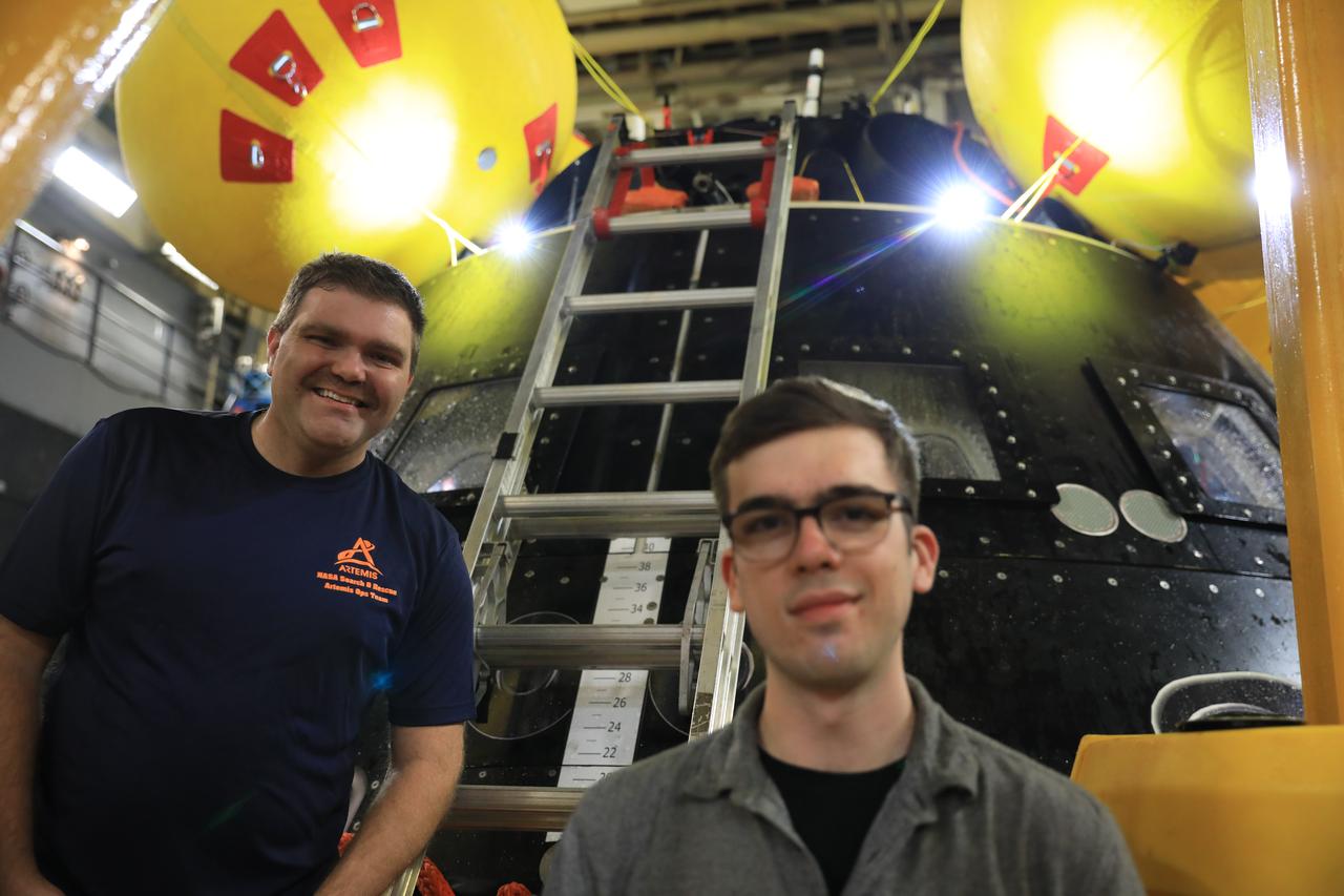 Members of NASA’s Exploration Ground System’s Landing and Recovery team aboard the USS San Diego pose in front of a mockup of the Orion spacecraft during Underway Recovery Test 11 (URT-11) off the coast of San Diego, California on Sunday, Feb. 25, 2024. URT-11 is the eleventh in a series of Artemis recovery tests, and the first time NASA and its partners put their Artemis II recovery procedures to the test with the astronauts. 