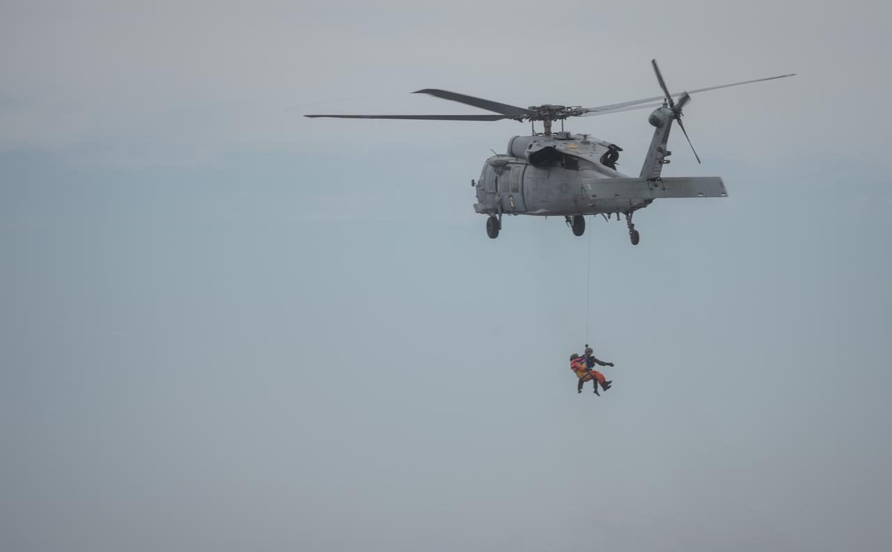 Members of the United States Navy Helicopter Sea Combat Squadron (HSC) 23 "Wildcards" practice recovery procedures from a mockup of the Orion spacecraft in the Pacific Ocean during Underway Recovery Test 11 (URT-11) with NASA’s Exploration Ground System’s Landing and Recovery team and partners from the Department of Defense aboard the USS San Diego off the coast of San Diego on Sunday, Feb. 25, 2024. URT-11 is the eleventh in a series of Artemis recovery tests, and the first time NASA and its partners put their Artemis II recovery procedures to the test with the astronauts.